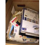 A box of stamp albums and first day covers Catalogue only, live bidding available via our webiste.