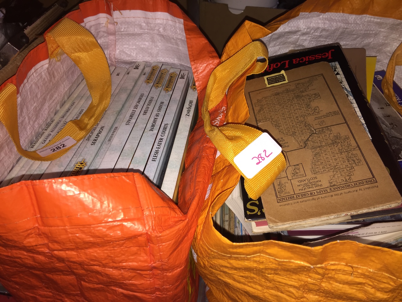 A bag of Warhammer books and a bag of books on local history. Catalogue only, live bidding available