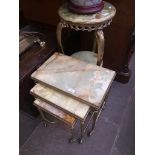 Three onyx and brass effect tables comprising a two tier stand, nest of three tables and a coffee