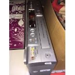 A Sanyo DVD player and video cassette recorder. Catalogue only, live bidding available via our