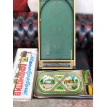 Bagatelle game and a Russian clockwork tin train set Catalogue only, live bidding available via our