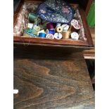 Wooden conical sewing box with contents to include bobbins. Catalogue only, live bidding available