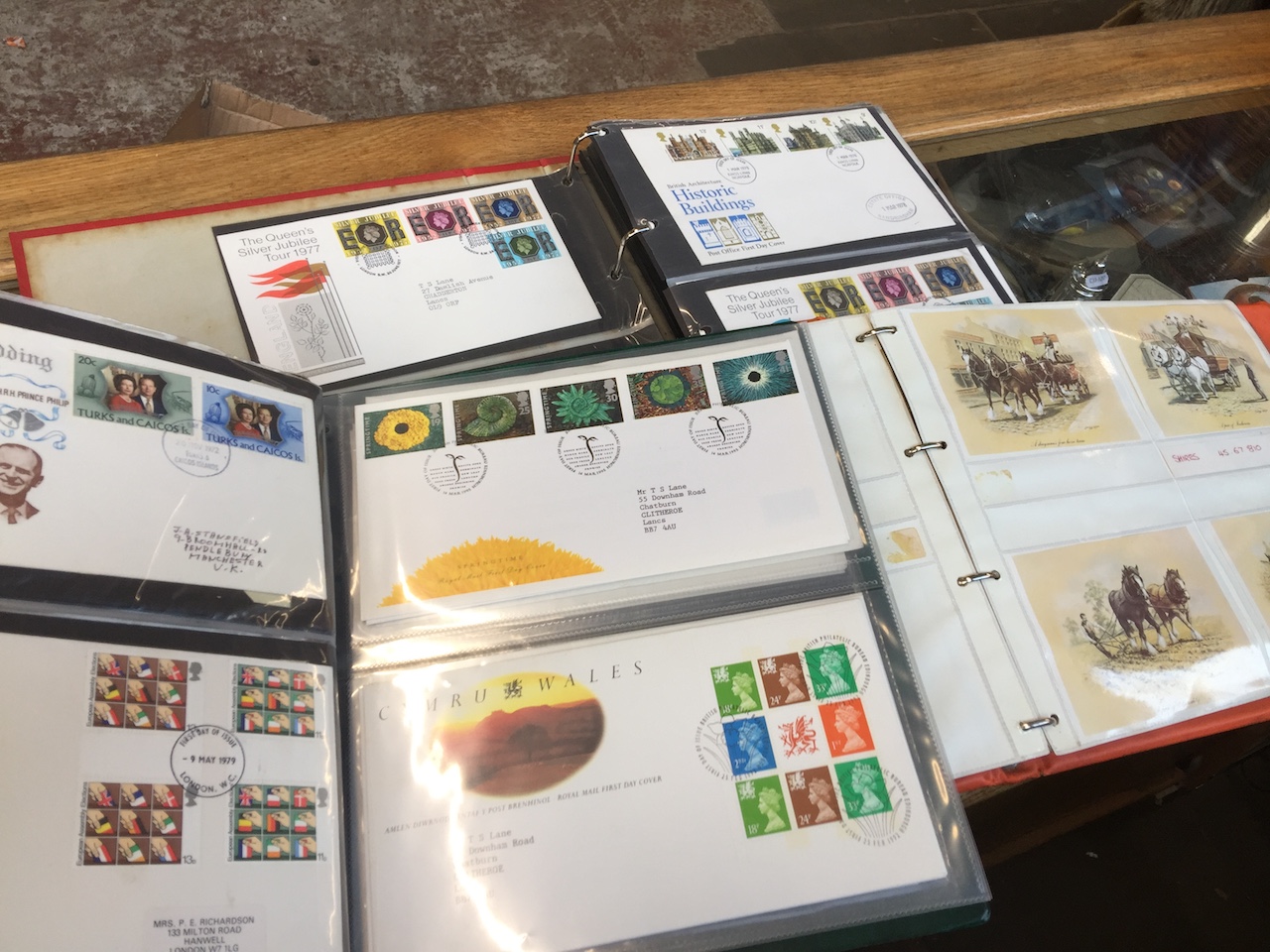 Three albums of stamps and first day covers and postcards Catalogue only, live bidding available via