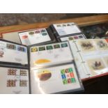 Three albums of stamps and first day covers and postcards Catalogue only, live bidding available via