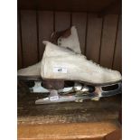 A pair of vintage ice skates Catalogue only, live bidding available via our webiste. If you