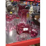 6 pieces modern glassware, cranberry colour, and a large glass peacock Catalogue only, live