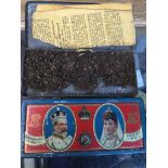 Two 1902 Coronation tins with original contents, one containing tobacco and the other with foiled