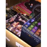 A box with various collections of DVDs related to Star Trek, Farscape, Stargate SG1, etc.