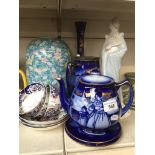 Blue pottery teapot, stand and jug with Dutch scenes, Nao figure, cups and saucers, large vase and