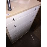 A tall modern white and light wood effect chest of drawers and a glazed front cabinet Catalogue