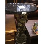 A gilt plaster cherub base and granite top table Catalogue only, live bidding available via our