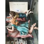 Naples porcelain boy and girl on cushions Catalogue only, live bidding available via our webiste. If