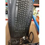 A box of computer peripherals to include 3 keyboards, mouse, etc. Catalogue only, live bidding