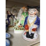 Two Staffordshire pottery figures and a toby jug Catalogue only, live bidding available via our