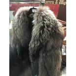 A silver fox fur jacket, plain model, no pockets, appears without damages. Catalogue only, live
