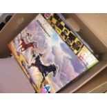 A box of jigsaws and games Catalogue only, live bidding available via our webiste. If you require