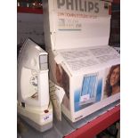 A Morphy Richards cordless iron and a Philips UVA sunlamp. Catalogue only, live bidding available