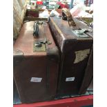 Two vintage suitcases, one containing opera and theatre programmes,