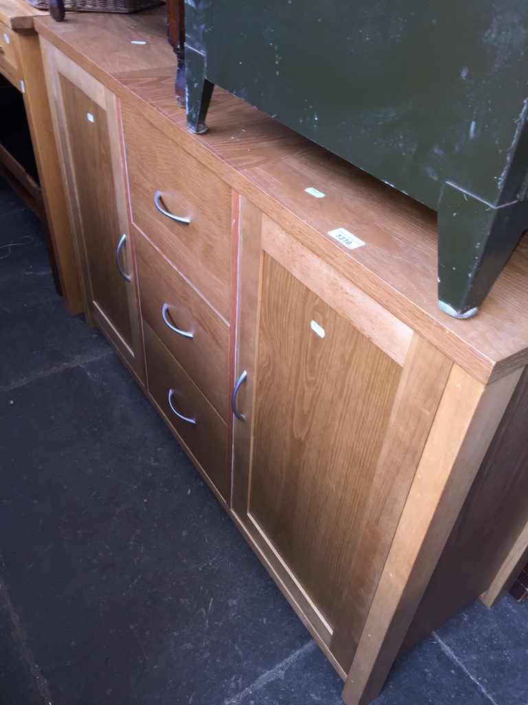 A modern light oak sideboard Catalogue only, live bidding available via our webiste. If you