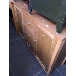 A modern light oak sideboard Catalogue only, live bidding available via our webiste. If you