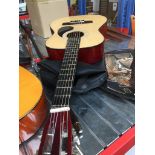 A Burswood acoustic guitar with soft case. Catalogue only, live bidding available via our webiste.