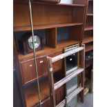 A teak room divider cabinet and a teak bookcase cabinet Catalogue only, live bidding available via