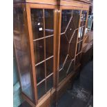 A reproduction breakfront glazed bookcase cabinet on turned legs. Catalogue only, live bidding