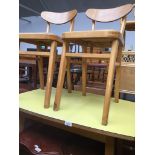 A 1950s formica top kitchen table and two chairs Catalogue only, live bidding available via our