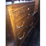 An oak chest of drawers with middle dummy drawer drop down Catalogue only, live bidding available