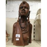 A carved ethnic female bust Catalogue only, live bidding available via our webiste. If you require