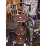 An oak cake stand Catalogue only, live bidding available via our webiste. If you require P&P