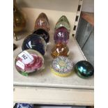 A group of eight glass paperweights. Catalogue only, live bidding available via our webiste. If