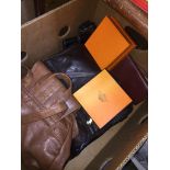 A box of handbags, purses, Hermes belts, some leather Catalogue only, live bidding available via our