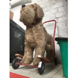A 1960's Pedigree Soft Toys LTD mohair push along dog. Catalogue only, live bidding available via