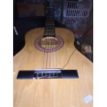 A Cleca acoustic guitar with soft case. Catalogue only, live bidding available via our webiste. If