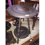 A 19th century two tier tripod table with turned legs Catalogue only, live bidding available via our