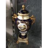 Coalport blue and gilt vase and cover with painted landscape vignette Catalogue only, live bidding