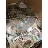 A box containing large quantity of cigarette cards. Catalogue only, live bidding available via our