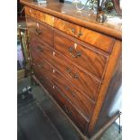 A mahogany scotch chest of drawers with brass swan neck handles on bracket feet - foot damaged