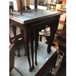 A glass top nest of tables The-saleroom.com showing catalogue only, live bidding available via our