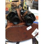 A pair of WWII Bausch & Lomb mimlitary field binoculars in leather case The-saleroom.com showing