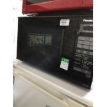A black Panasonic microwave The-saleroom.com showing catalogue only, live bidding available via