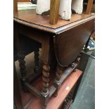 Oak twist leg drop leaf table The-saleroom.com showing catalogue only, live bidding available via