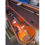 A violin with bow in case. The-saleroom.com showing catalogue only, live bidding available via our