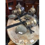A pair of Arts & Crafts style wrought metal and brass wall sconces with oil lamps The-saleroom.com