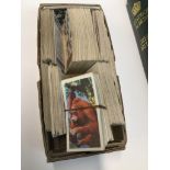 A box of cigarette cards The-saleroom.com showing catalogue only, live bidding available via our