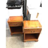 A pair of yew wood bedside cabinets