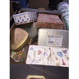 A box of old tins and haberdashery items. The-saleroom.com showing catalogue only, live bidding