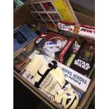 A box of Star Wars, Ghostbusters and other types of games and toys. The-saleroom.com showing