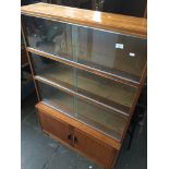 Sliding glass teak bookcase The-saleroom.com showing catalogue only, live bidding available via